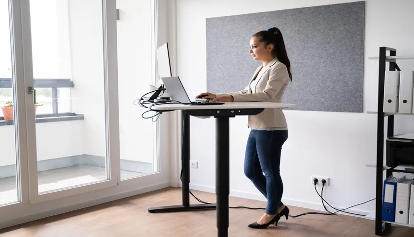 man working at a desk standing