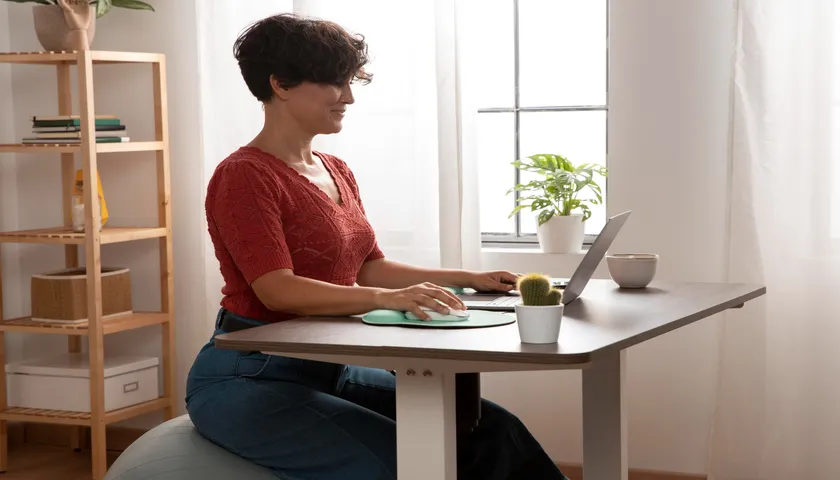 desk with 3 monitors and height adjustment